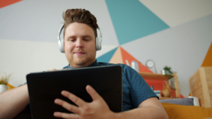 Person watching streaming content on a tablet device